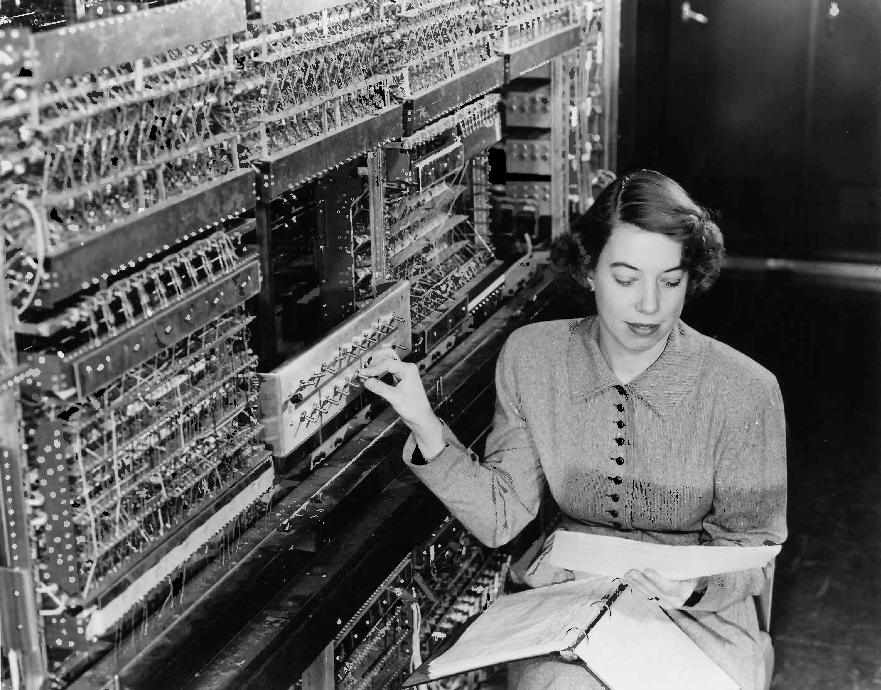 Jean F. Hall adjusting controls on AVIDAC, Argonne National Laboratory's first computer, 1953