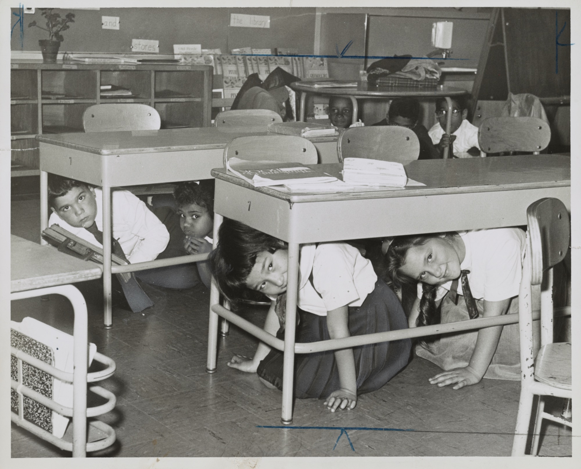 Children crawling under their desks during a take-cover drill at P.S. 58 in Brooklyn, 1962