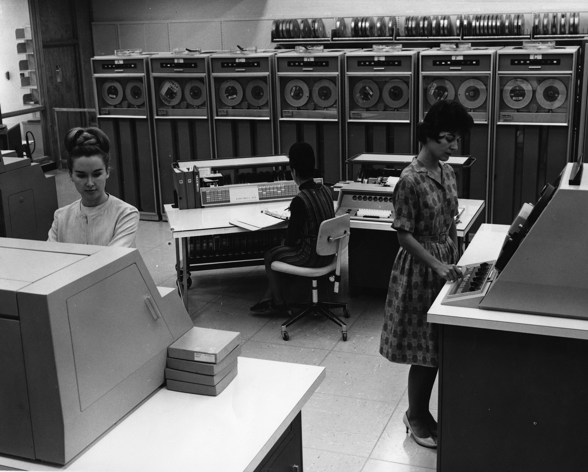Three women working with a Honeywell 800 mainframe, 1960s